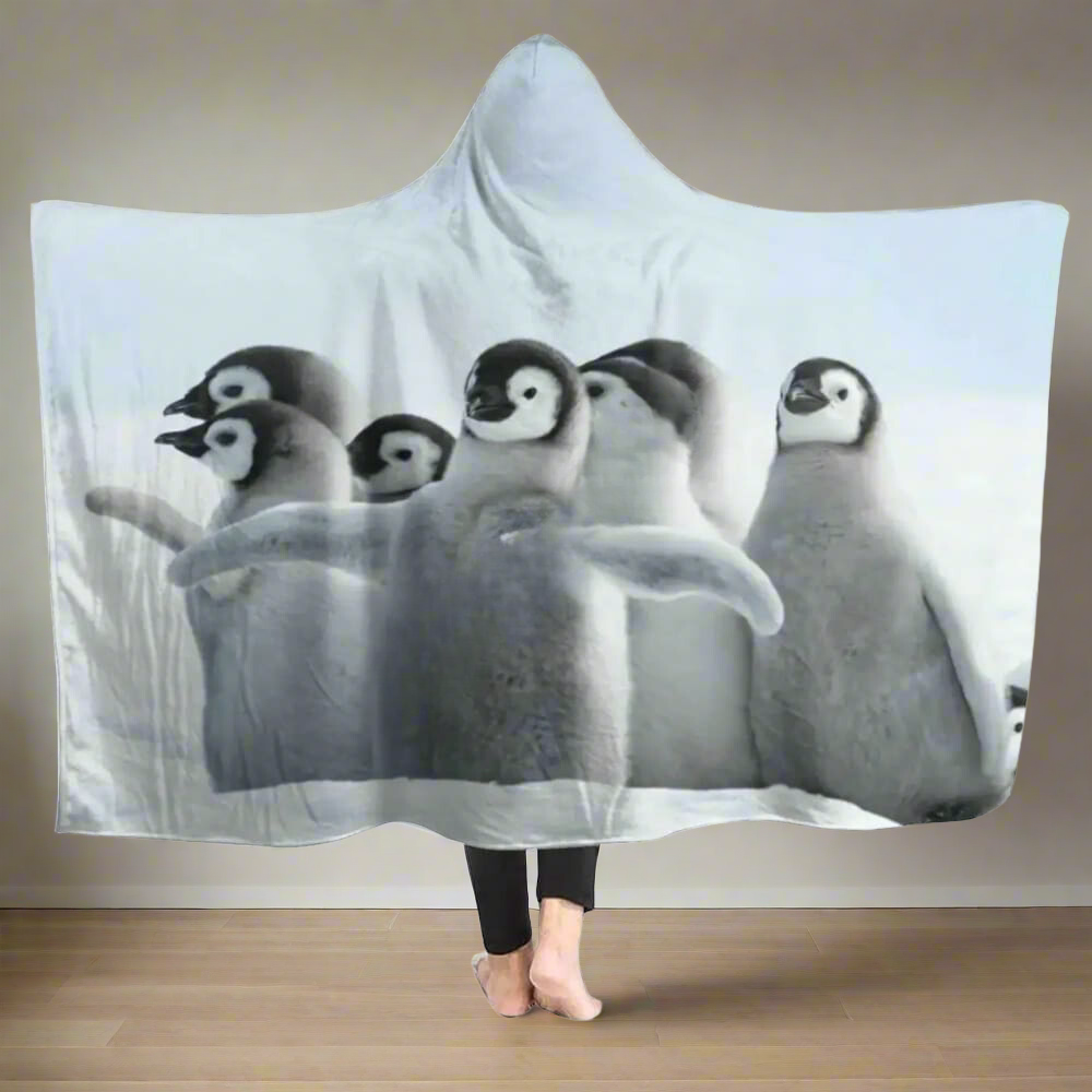 flock-penguin-blanket-hoodie-model-in-the-bedroom