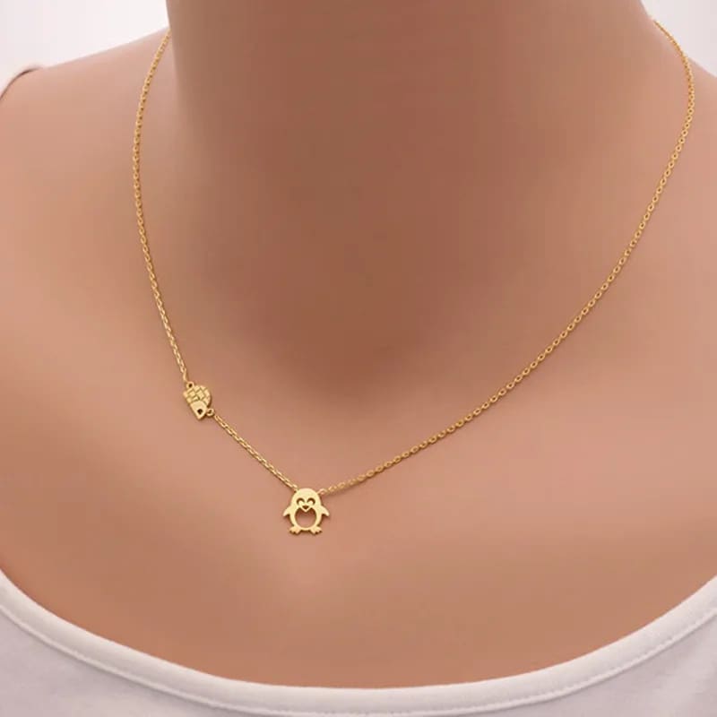 Gold penguin necklace