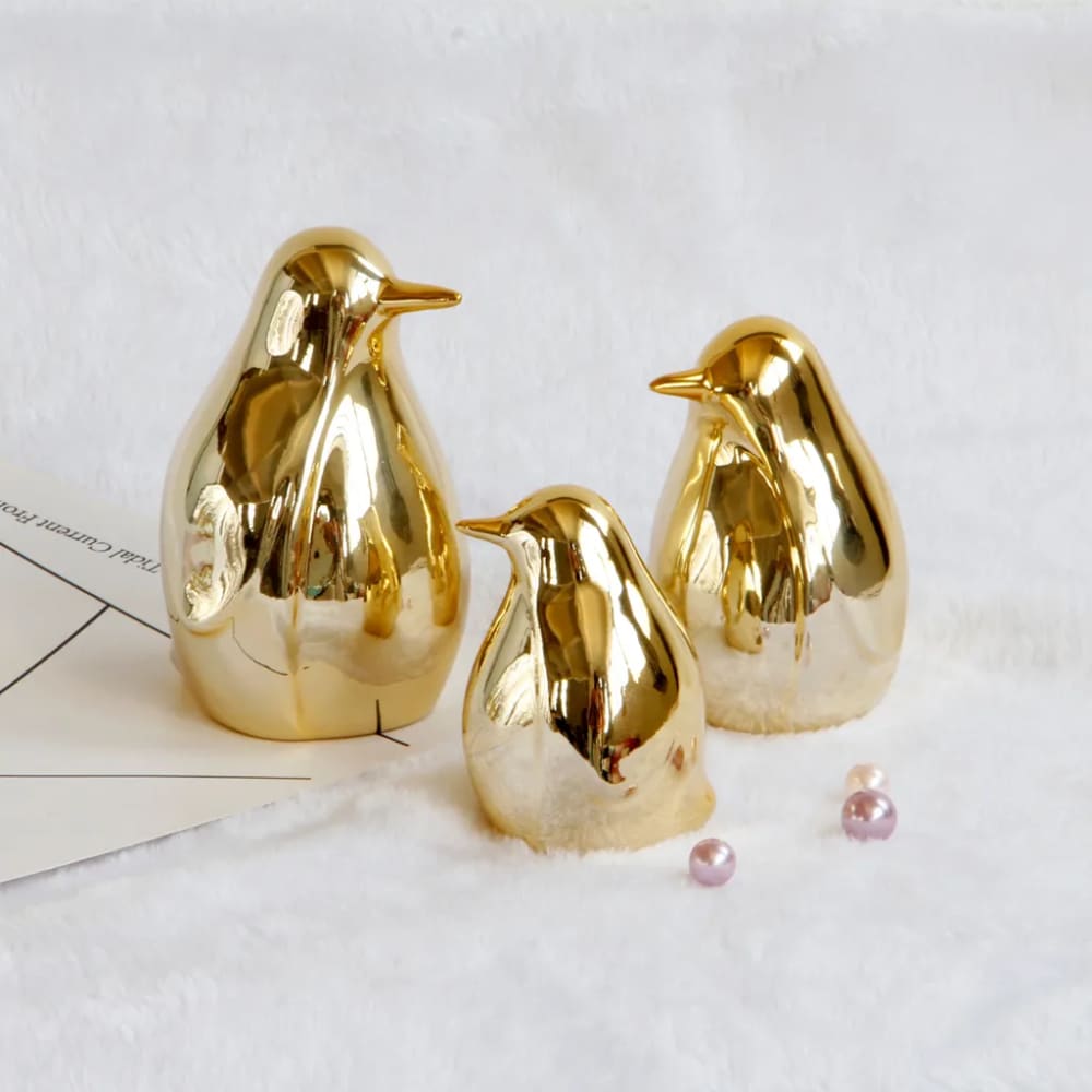 penguin figurine with gold