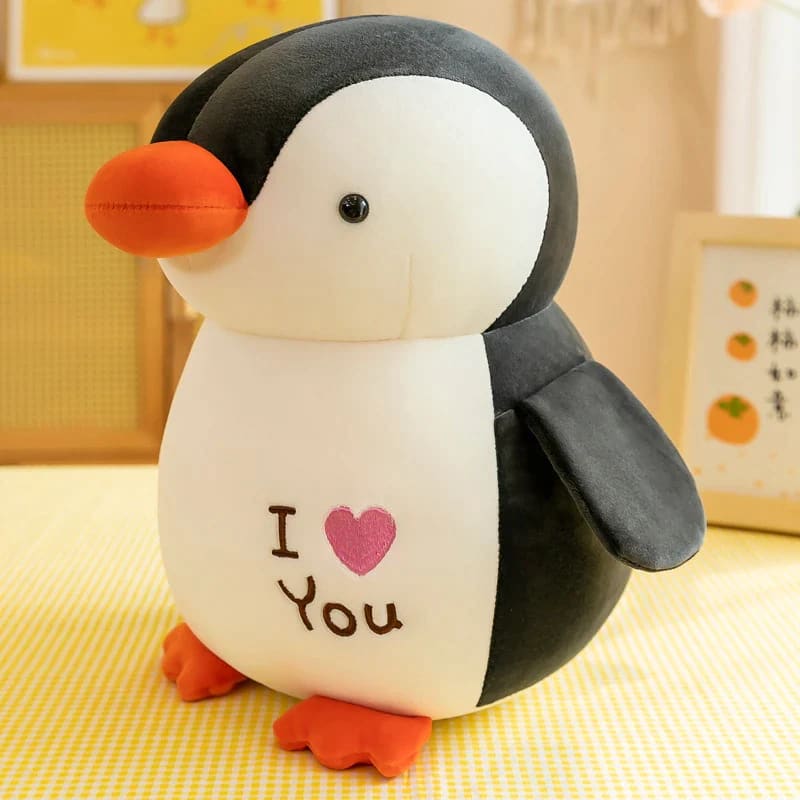 Plush penguin with heart