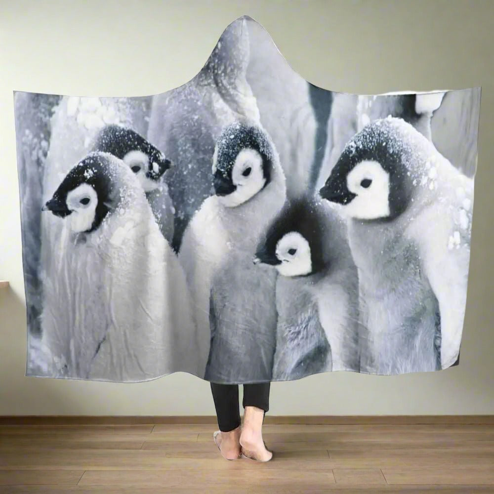A-model-with-the-tribe-penguin-blanket-hoodie-in-a-room